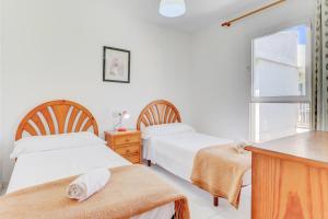 Posteľ alebo postele v izbe v ubytovaní Apartamentos Llevant