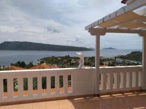 a white railing with a view of the water at Anatoli Villa in Steni Vala Alonissos
