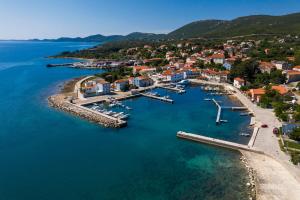 an aerial view of a harbor with boats in the water at Apartmani Danica in Nerezine