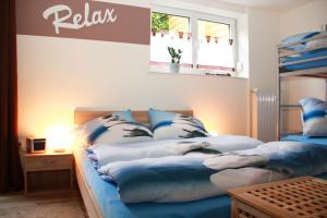 Кровать или кровати в номере Ferienwohnung-Wieber