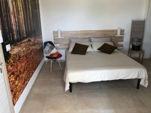 Postel nebo postele na pokoji v ubytování Tramontana Tre Archi B&B