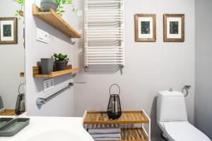 a bedroom with a bed and a desk with a lamp at Czas na Puszczę in Puszcza Mariańska +34 photos