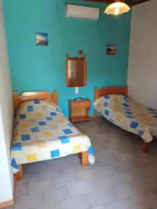 Posteľ alebo postele v izbe v ubytovaní Asimina's House
