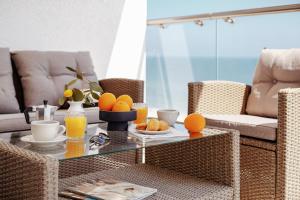 a living room with a coffee table with oranges on it at Lucky Residence in Zatoka