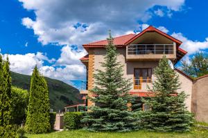 a house with trees in front of it at Tsaghkadzor Homeland in Tsaghkadzor