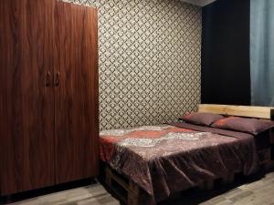 Кровать или кровати в номере Shapatava ApartHotel