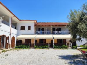 a large white building with a balcony on top of it at Tenuta Marga in Agnone