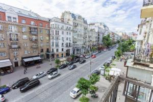 a view of a city street with cars parked at Partner Guest House Velyka Vasylkivska in Kyiv