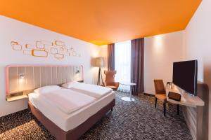 Postel nebo postele na pokoji v ubytování Park Inn by Radisson Neumarkt