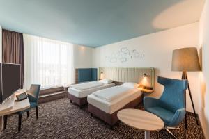 Postel nebo postele na pokoji v ubytování Park Inn by Radisson Neumarkt
