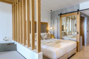 a bedroom with two beds in a room at Stella Palace Aqua Park Resort in Hersonissos
