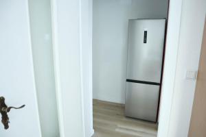a kitchen with a stainless steel refrigerator in a room at Work & Travel in Remscheid