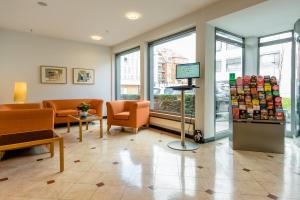 TV a/nebo společenská místnost v ubytování Schlosspark Hotel