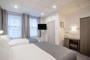 Llit o llits en una habitació de Comfort Inn Blackpool Gresham