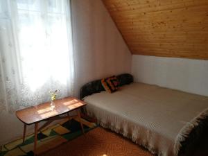 Posteľ alebo postele v izbe v ubytovaní Holiday House Retro