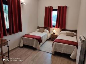 Postel nebo postele na pokoji v ubytování CASA SARTZALETA-Navarra-España