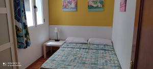 En eller flere senge i et værelse på Apartamento "CASA LOS SABANDEÑOS"