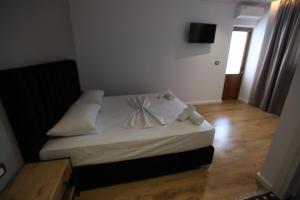Postel nebo postele na pokoji v ubytování Blue Bay Hotel