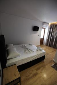 Postel nebo postele na pokoji v ubytování Blue Bay Hotel