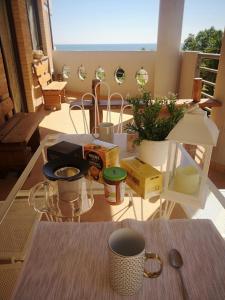 a room with a table with a coffee maker on it at Cala di Rio B&B in Termoli +36 photos