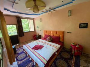 Rúm í herbergi á Riad Atlas Garden