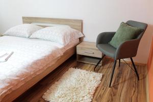 Posteľ alebo postele v izbe v ubytovaní Guest House Vila Pod Lesom