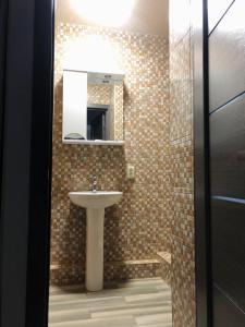 Ett badrum på Bloom Hotel