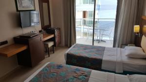 Postel nebo postele na pokoji v ubytování Sultan Sipahi Resort Hotel