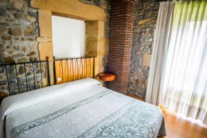 Postel nebo postele na pokoji v ubytování Hotel Palacio Atxega