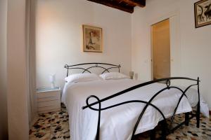 Un ou plusieurs lits dans un hébergement de l'établissement Casa dea corte apartment