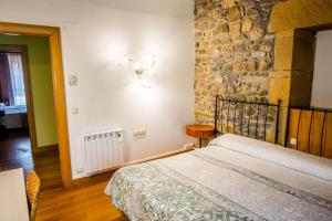 Postel nebo postele na pokoji v ubytování Hotel Palacio Atxega