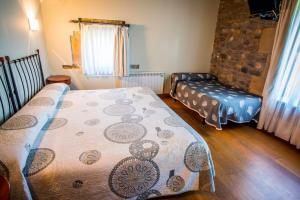 Postel nebo postele na pokoji v ubytování Hotel Palacio Atxega