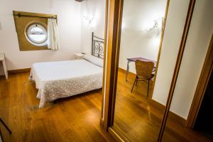 Postel nebo postele na pokoji v ubytování Hotel Palacio Atxega