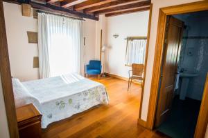Säng eller sängar i ett rum på Hotel Palacio Atxega