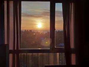 a view of the sunset from a window at Lo de Mario al rio in Buenos Aires