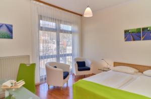 Una cama o camas en una habitación de Hotel Garni am Goetheplatz