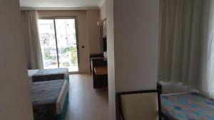 Postel nebo postele na pokoji v ubytování Sultan Sipahi Resort Hotel