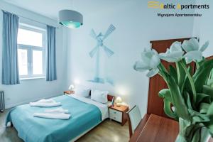 Säng eller sängar i ett rum på Baltic Apartments - Willa Nemuna