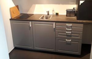 a kitchen with a sink and a counter top at M18 in Copenhagen