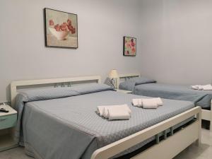 Postel nebo postele na pokoji v ubytování Palia's Hotel