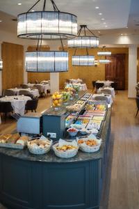 a buffet table with many different types of food at Dukes' Arches Brugge Adults only in Bruges