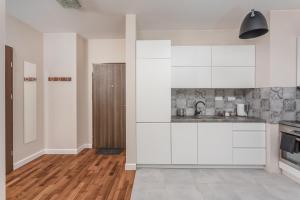 Kuchyň nebo kuchyňský kout v ubytování Chill Apartments City Link