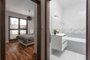 Postel nebo postele na pokoji v ubytování Chill Apartments City Link