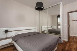 Postel nebo postele na pokoji v ubytování Chill Apartments City Link