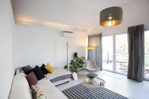 a living room with a couch and a table at River house Grana in Belgrade