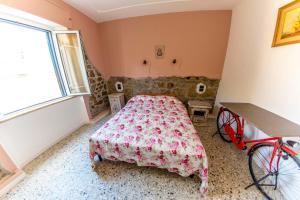 Postel nebo postele na pokoji v ubytování Affittacamere Nonna Nana
