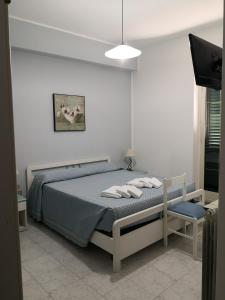 Postel nebo postele na pokoji v ubytování Palia's Hotel
