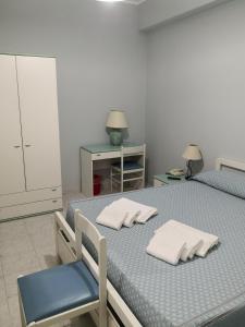 Postel nebo postele na pokoji v ubytování Palia's Hotel