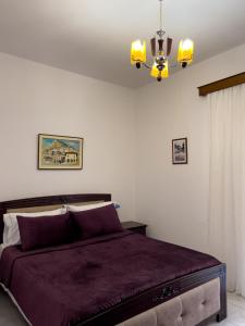 Cama ou camas em um quarto em White Villa