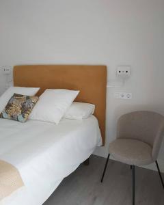 Łóżko lub łóżka w pokoju w obiekcie Apartamentos Pontedeume Riadoeume